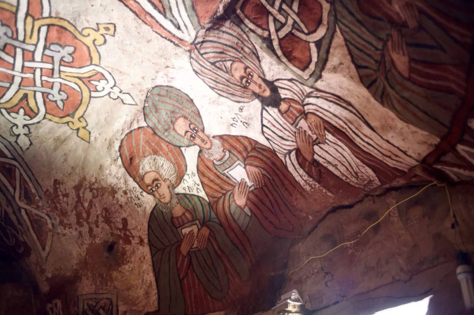Painted ceiling murals inside Abuna Yemata Guh