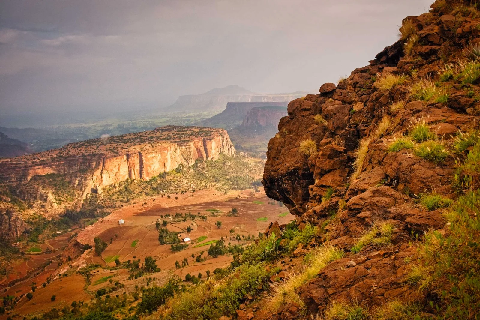 A walking trail along red sandstone cliffs in Tigray